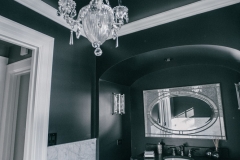 Elegant Chandelier in An Edgy Bathroom Part of A Classic Home Renovation