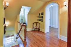 Open Hallway with Skylight in French Manor Home