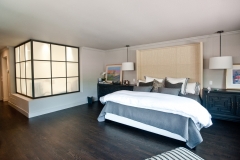 Modern Bedroom with Glass Wall to Bathroom Created By Residential General Contractors Near Me