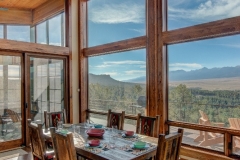 Open Mountain Home Dining Room With Windows For Walls & Breathtaking Views