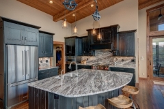 Open Kitchen Design with Large Granite Island in Mountain Home Renovation